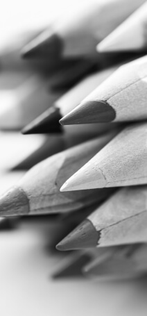 Black and white photo showing a bunch of coloring pencils